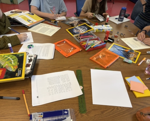 View of the diverse set of materials used for this workshop : paper, ruler, scissors, colourful pencils, images to cut.